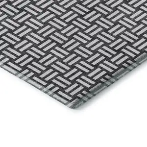 Photo of Black And Ivory Abstract Geometric Washable Area Rug With UV Protection