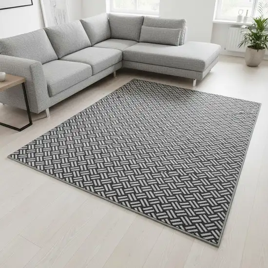 Black And Ivory Abstract Geometric Washable Area Rug With UV Protection Photo 2