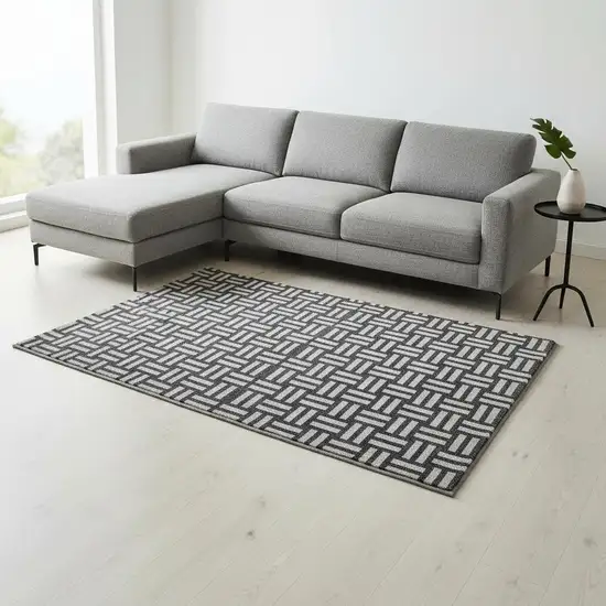 Black And Ivory Abstract Geometric Washable Area Rug With UV Protection Photo 2