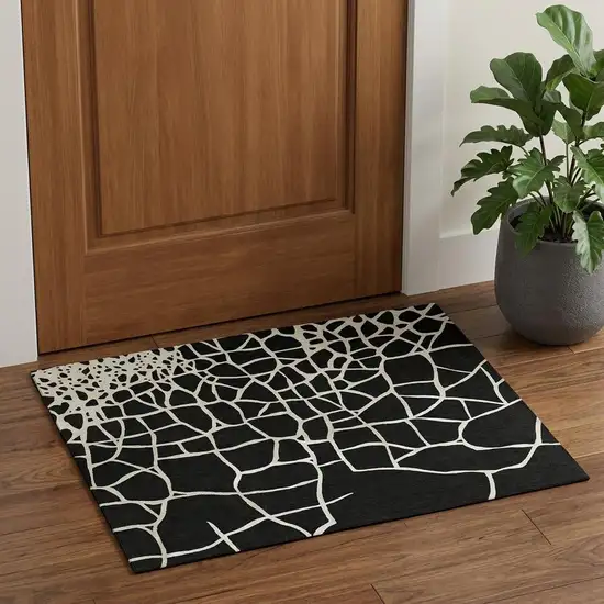 Black And Ivory Abstract Geometric Washable Area Rug With UV Protection Photo 1