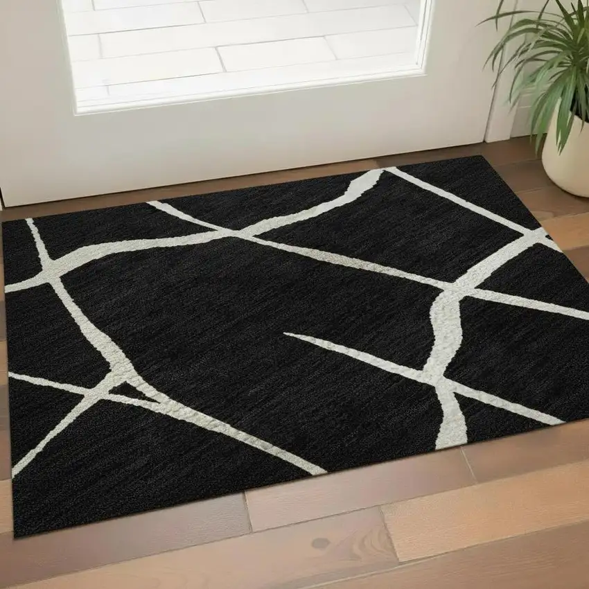 Black And Ivory Abstract Geometric Washable Area Rug With UV Protection Photo 2
