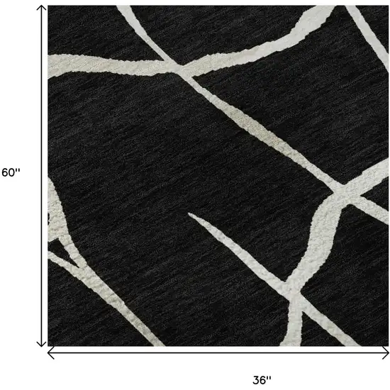 Black And Ivory Abstract Geometric Washable Area Rug With UV Protection Photo 9