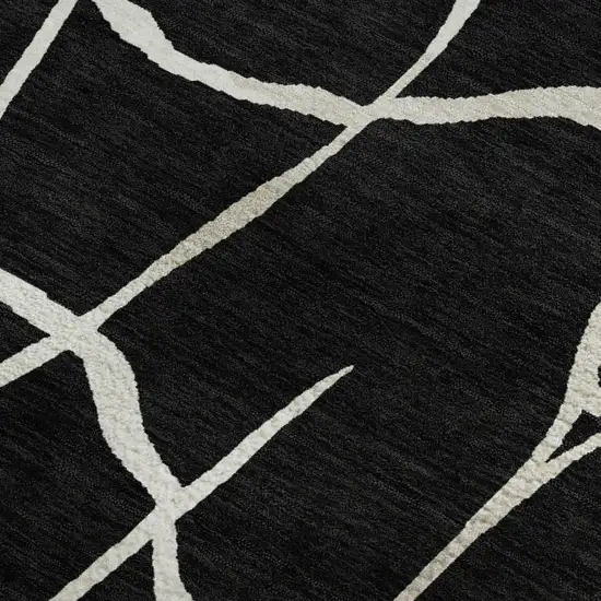 Black And Ivory Abstract Geometric Washable Area Rug With UV Protection Photo 2