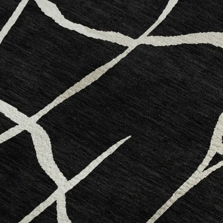 Black And Ivory Abstract Geometric Washable Area Rug With UV Protection Photo 2