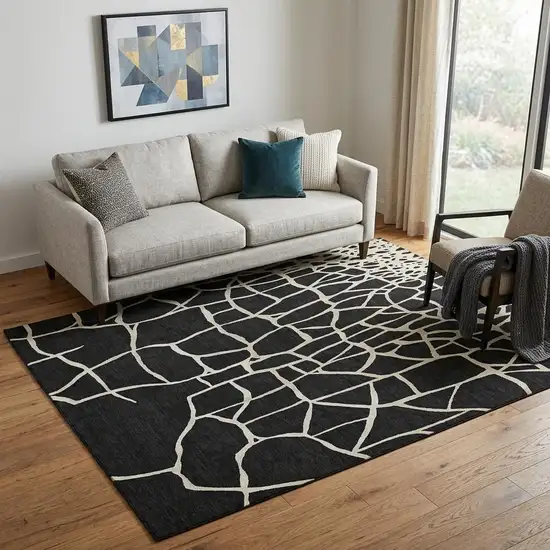 Black And Ivory Abstract Geometric Washable Area Rug With UV Protection Photo 1