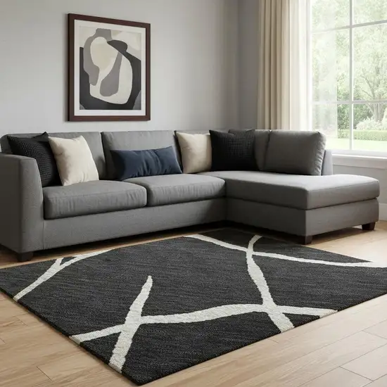 Black And Ivory Abstract Geometric Washable Area Rug With UV Protection Photo 2