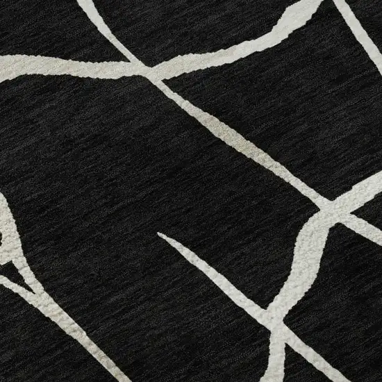 Black And Ivory Abstract Geometric Washable Area Rug With UV Protection Photo 1