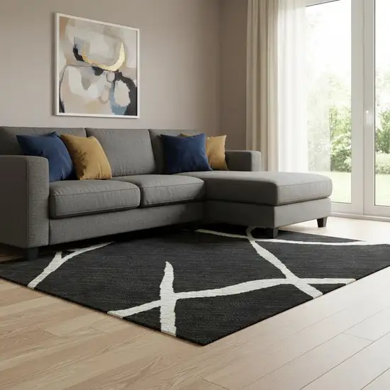 Black And Ivory Abstract Geometric Washable Area Rug With UV Protection Photo 2