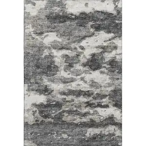 Photo of Black And Ivory Abstract Washable Area Rug With UV Protection