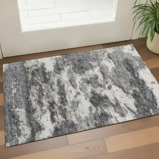 Black And Ivory Abstract Washable Area Rug With UV Protection Photo 1