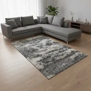 Photo of Black And Ivory Abstract Washable Area Rug With UV Protection