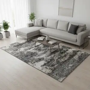Photo of Black And Ivory Abstract Washable Area Rug With UV Protection