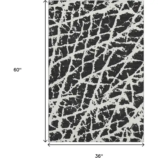 Black And Ivory Abstract Washable Area Rug With UV Protection Photo 3