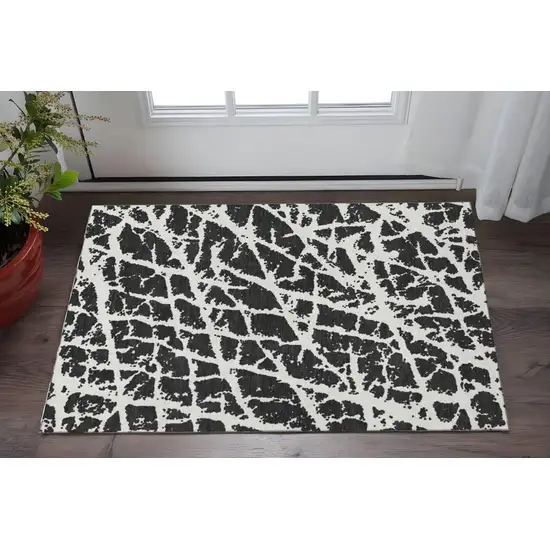 Black And Ivory Abstract Washable Area Rug With UV Protection Photo 2