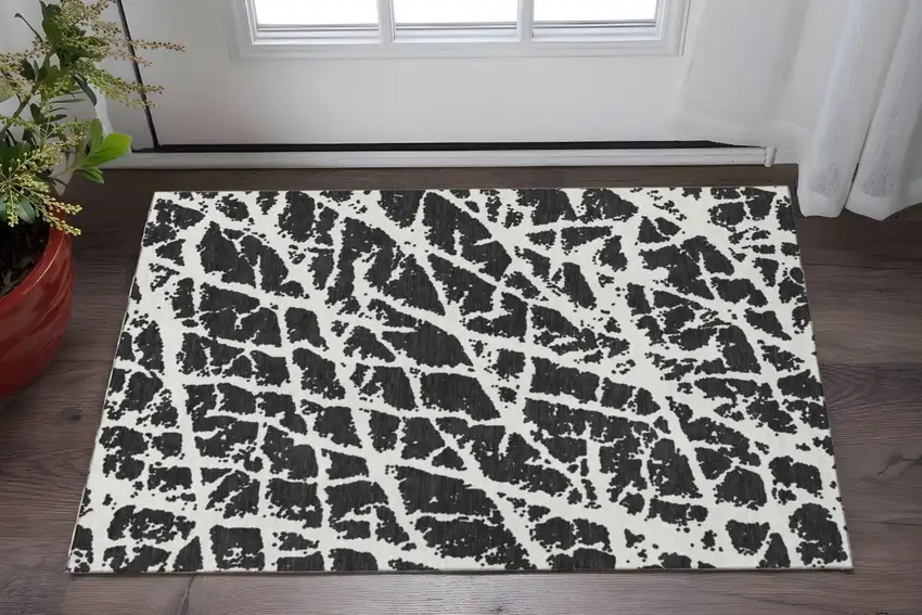 Black And Ivory Abstract Washable Area Rug With UV Protection Photo 2