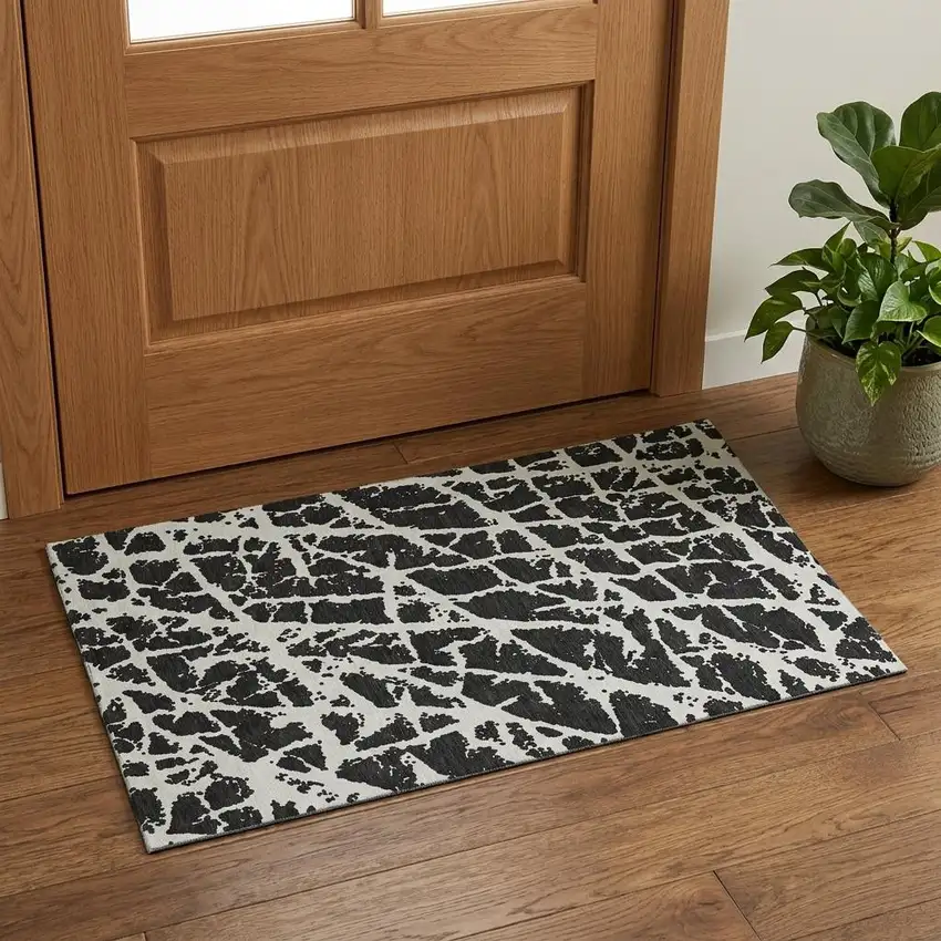 Black And Ivory Abstract Washable Area Rug With UV Protection Photo 1