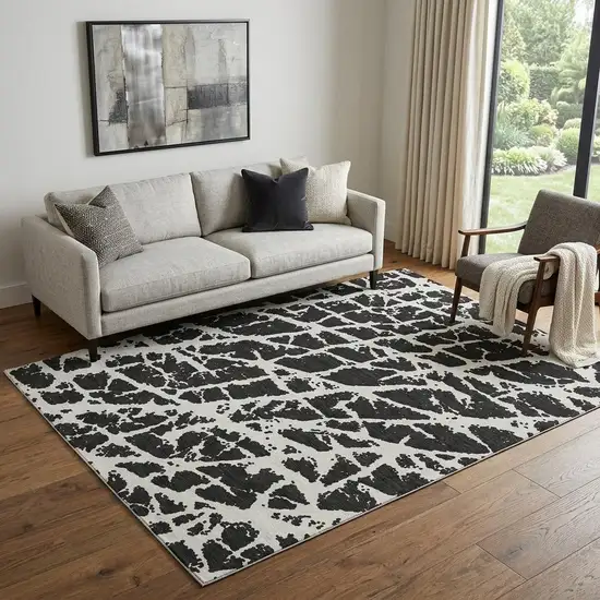Black And Ivory Abstract Washable Area Rug With UV Protection Photo 1