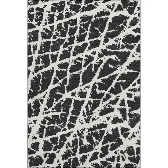 Black And Ivory Abstract Washable Area Rug With UV Protection Photo 1