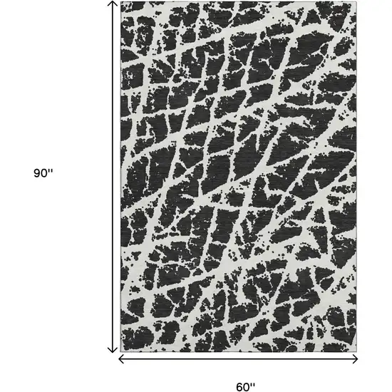Black And Ivory Abstract Washable Area Rug With UV Protection Photo 3