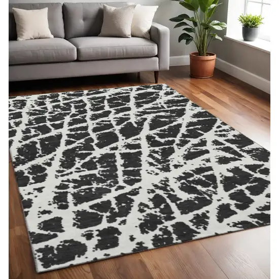 Black And Ivory Abstract Washable Area Rug With UV Protection Photo 2