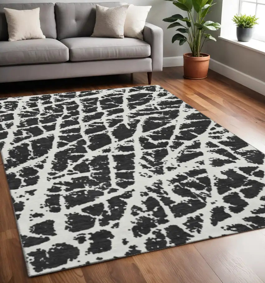 Black And Ivory Abstract Washable Area Rug With UV Protection Photo 2