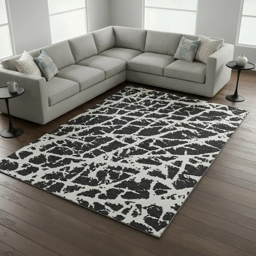 Black And Ivory Abstract Washable Area Rug With UV Protection Photo 1