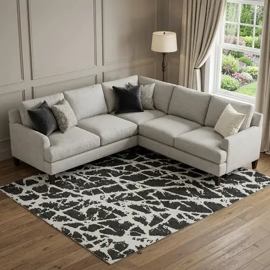 Black And Ivory Abstract Washable Area Rug With UV Protection Photo 1