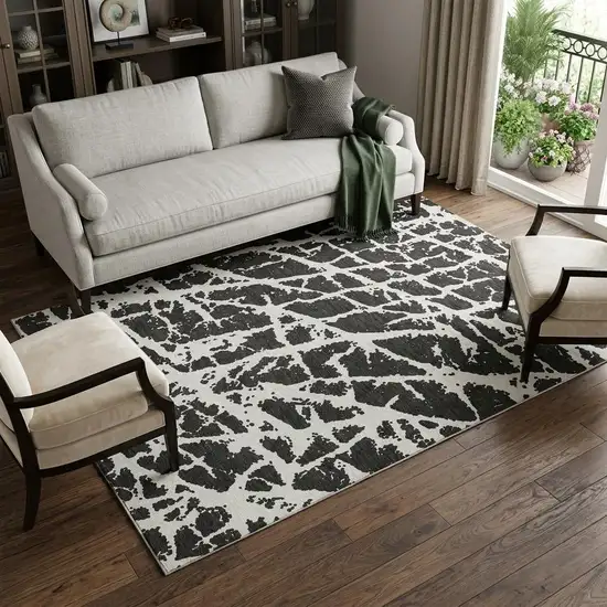 Black And Ivory Abstract Washable Area Rug With UV Protection Photo 1