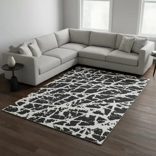 Black And Ivory Abstract Washable Area Rug With UV Protection Photo 1