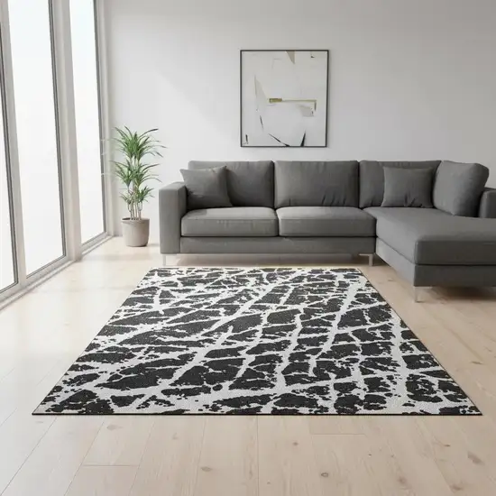 Black And Ivory Abstract Washable Area Rug With UV Protection Photo 1