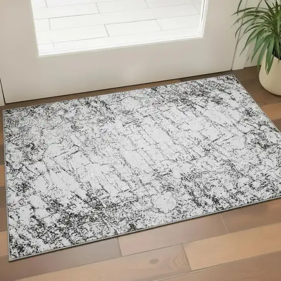 Black And Ivory Abstract Washable Area Rug With UV Protection Photo 2