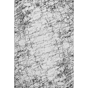 Photo of Black And Ivory Abstract Washable Area Rug With UV Protection