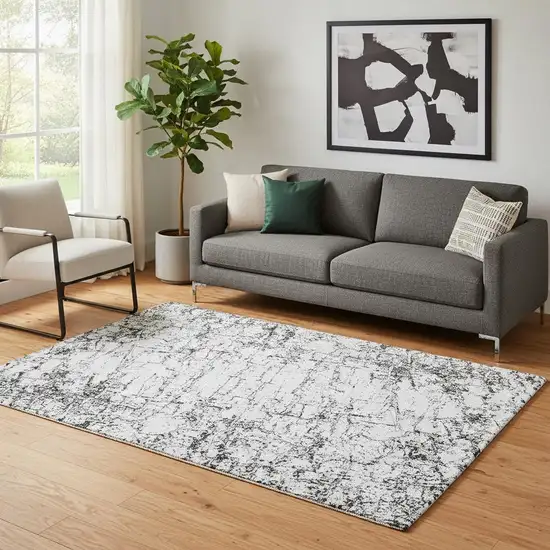 Black And Ivory Abstract Washable Area Rug With UV Protection Photo 1