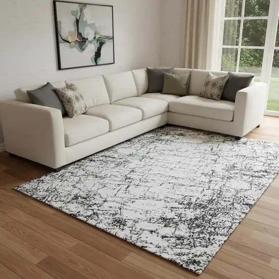 Black And Ivory Abstract Washable Area Rug With UV Protection Photo 1