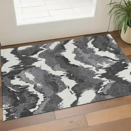 Black And Ivory Abstract Washable Area Rug With UV Protection Photo 1