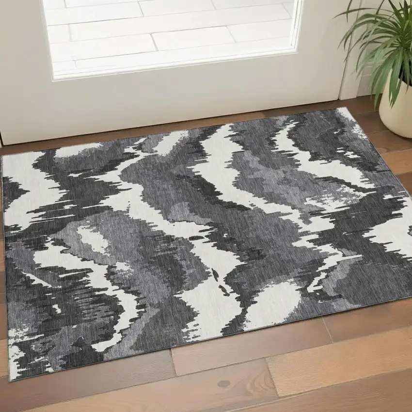 Black And Ivory Abstract Washable Area Rug With UV Protection Photo 1