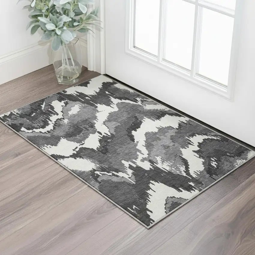 Black And Ivory Abstract Washable Area Rug With UV Protection Photo 1