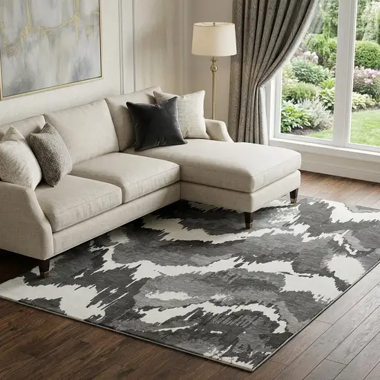 Black And Ivory Abstract Washable Area Rug With UV Protection Photo 1