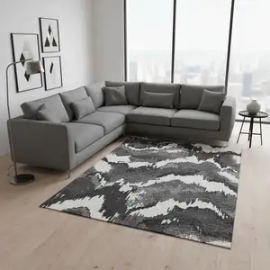 Photo of Black And Ivory Abstract Washable Area Rug With UV Protection