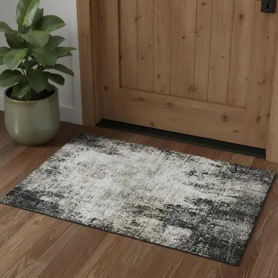 Black And Ivory Abstract Washable Area Rug With UV Protection Photo 1