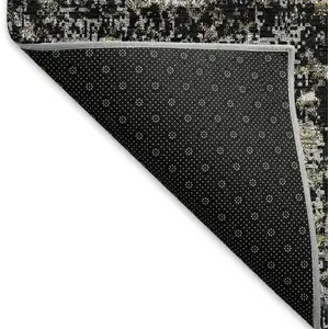 Photo of Black And Ivory Abstract Washable Area Rug With UV Protection