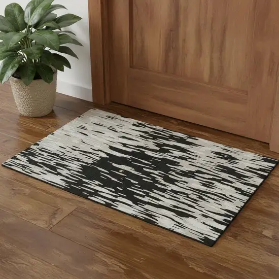 Black And Ivory Abstract Washable Area Rug With UV Protection Photo 1
