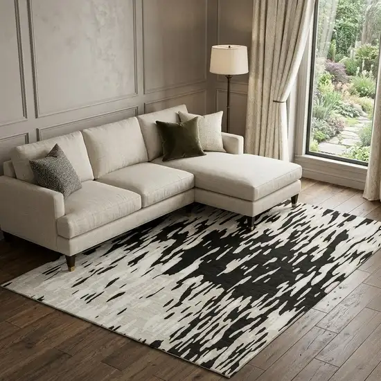 Black And Ivory Abstract Washable Area Rug With UV Protection Photo 1
