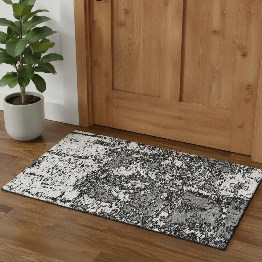 Black And Ivory Abstract Washable Area Rug With UV Protection Photo 1