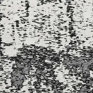 Photo of Black And Ivory Abstract Washable Area Rug With UV Protection