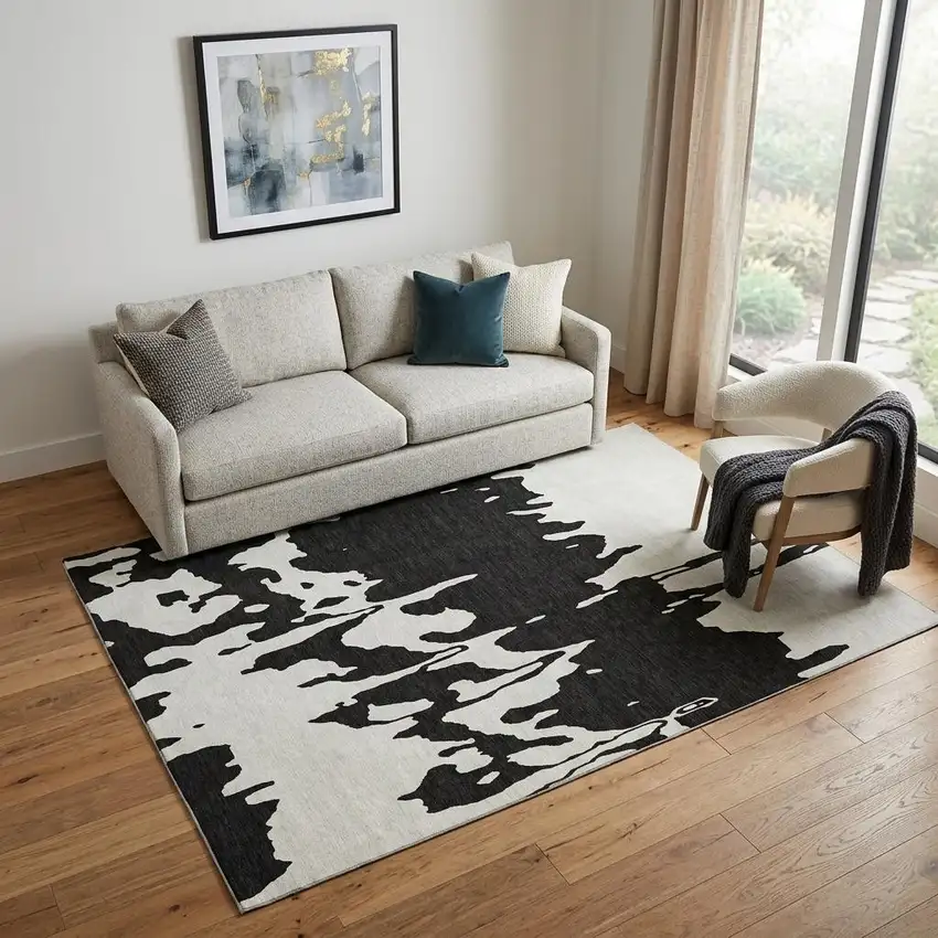 Black And Ivory Abstract Washable Area Rug With UV Protection Photo 1
