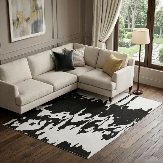 Black And Ivory Abstract Washable Area Rug With UV Protection Photo 1