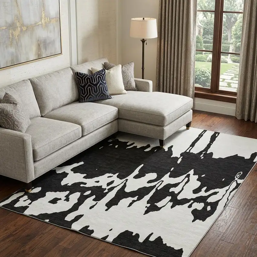 Black And Ivory Abstract Washable Area Rug With UV Protection Photo 1