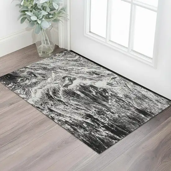 Black And Ivory Abstract Washable Area Rug With UV Protection Photo 2