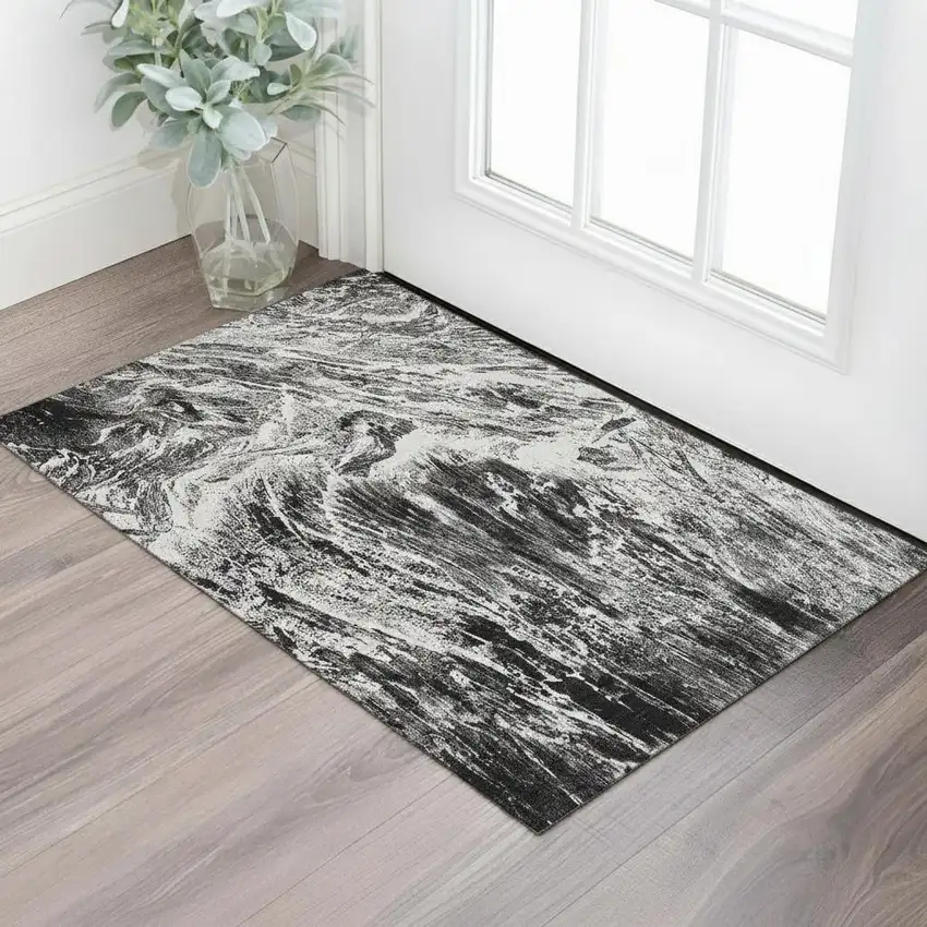 Black And Ivory Abstract Washable Area Rug With UV Protection Photo 2